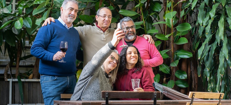 People drinking wine outside