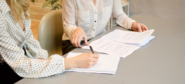 Two women negotiating in order to find a dream home in Canada