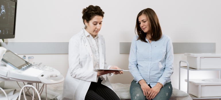 A woman at the doctor's office after moving from Surrey to East Gwillimbury