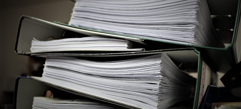 Piled up folders of documents