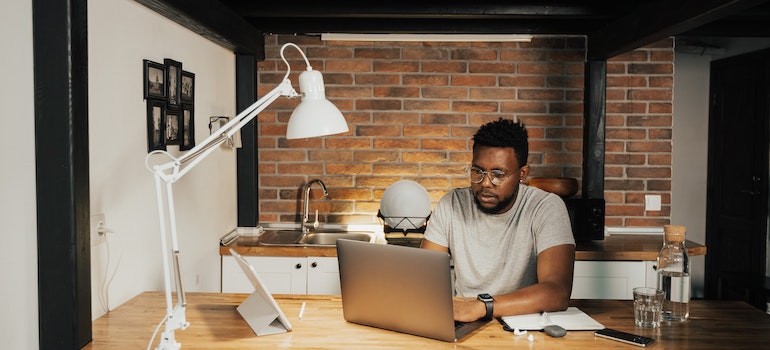 A person reading customer reviews after learning about the things to consider before renting a storage unit