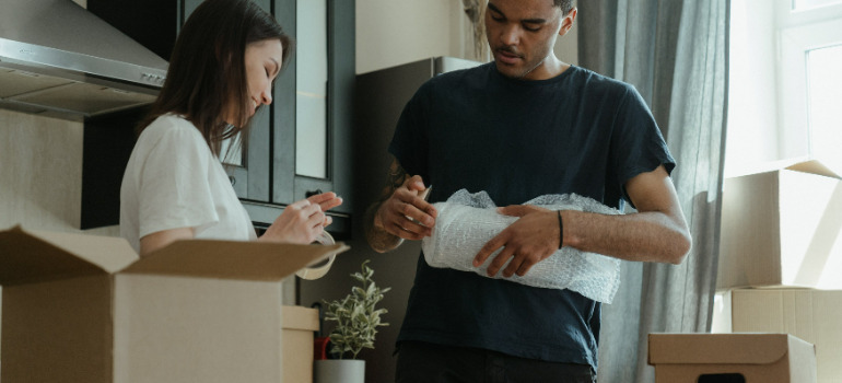 a girl and a boy packing