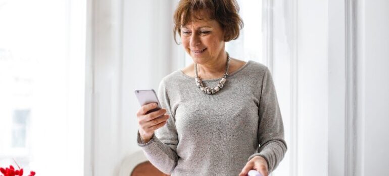 a woman holding a phone