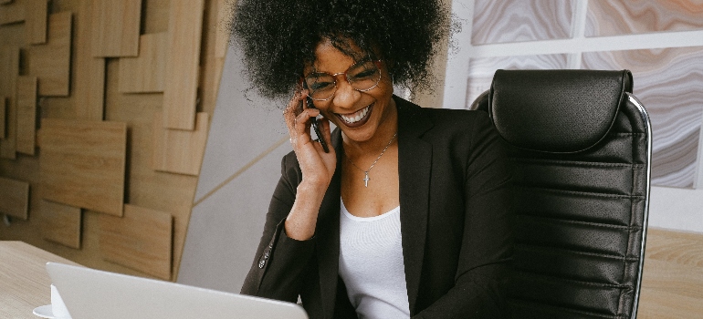 a woman talking over the phone after moving to Guelph