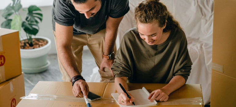 a couple creating a packing checklist and timeline
