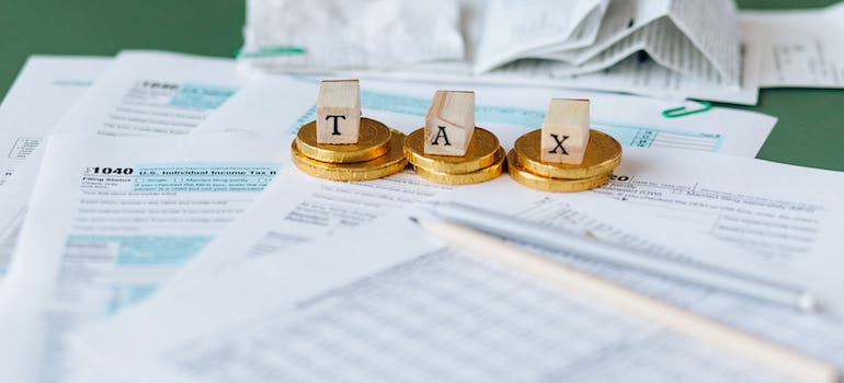 coins on a pile of tax papers