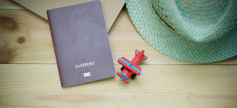 a passport and a plane toy on the table