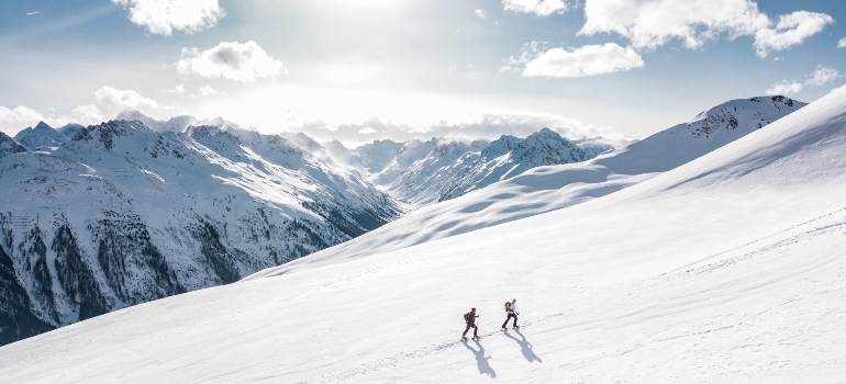People skiing at one of the best mountain towns to enjoy outdoor activities in Canada