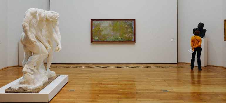 person in a museum thinking about the Toronto art scene