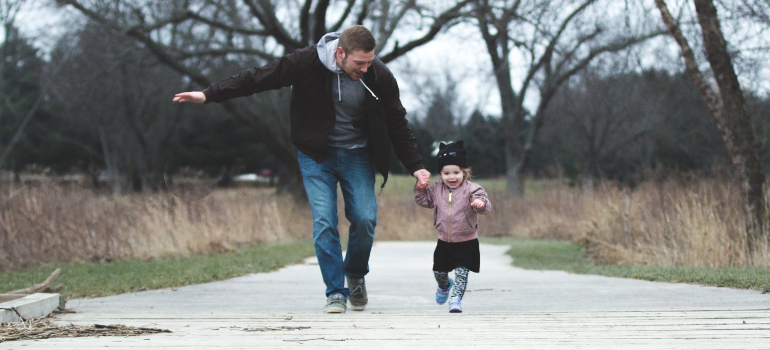 dad and daughter playing outside