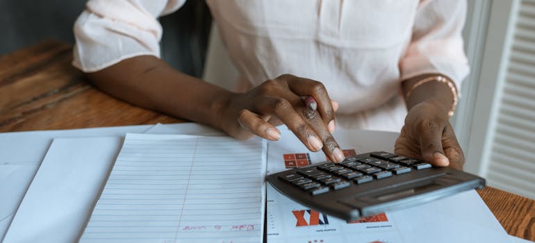 a woman using a calculator