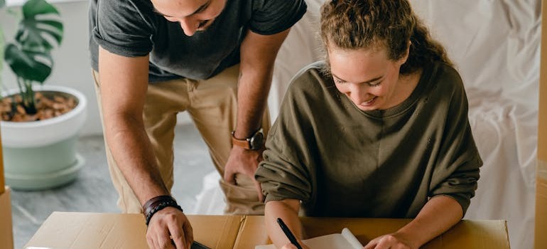 A couple going over the Canadian moving guide