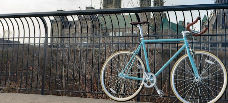 A blue bike near the parliament building