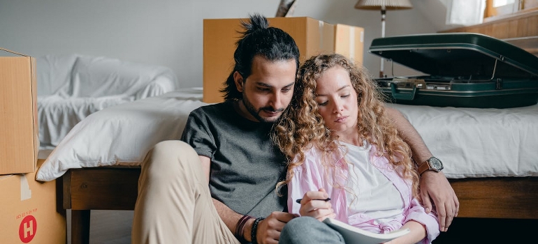 A couple taking notes and talking about the best cities to start a business in Canada