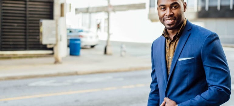 a man in a blue suit after starting a business in Canada as a foreigner