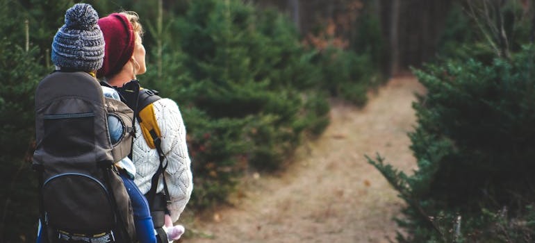 A woman hiking with her child, and wondering: is Montreal the perfect destination