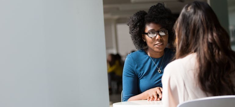 Two women talking about adjusting to life with kids in Toronto
