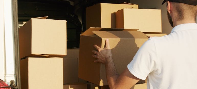 A mover unloading a van