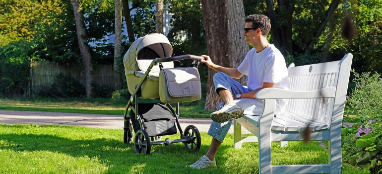 a parent siting on a bench
