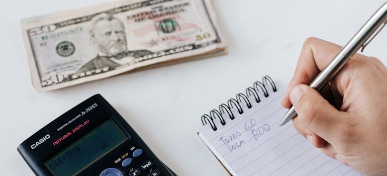 A person budgeting after reading about how to moving from Woodbridge ON to Markham ON on a budget