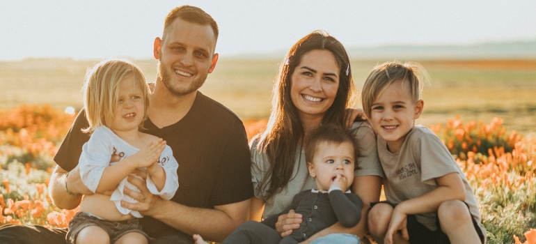 a family that is happy after they read a guide to living in Surrey