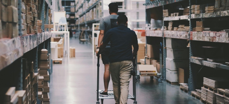 Men Going Around a Warehouse