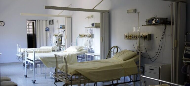 a hospital room with three beds