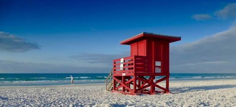 Red wooden life saver house at a beach in Sarasota, FL