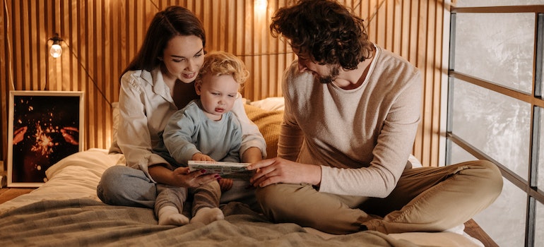 Family with their baby after discussing what is making so many Canadians leave Canada