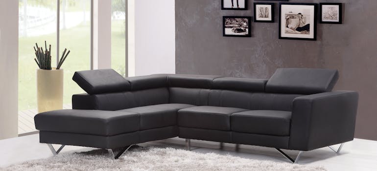 Photo of a sofa and paper on the floor that says things to pack and things to leave in storage when leaving Canada