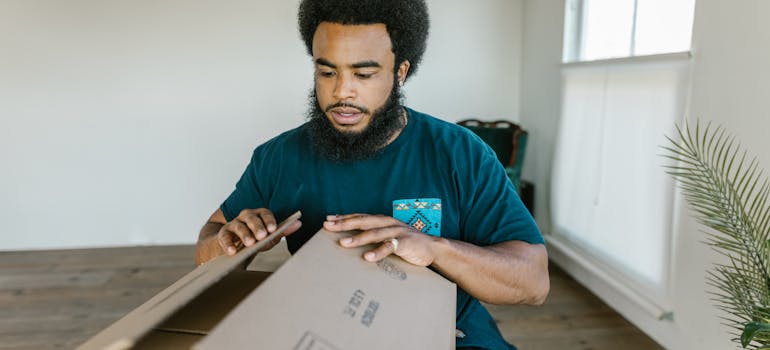 Man closing a box