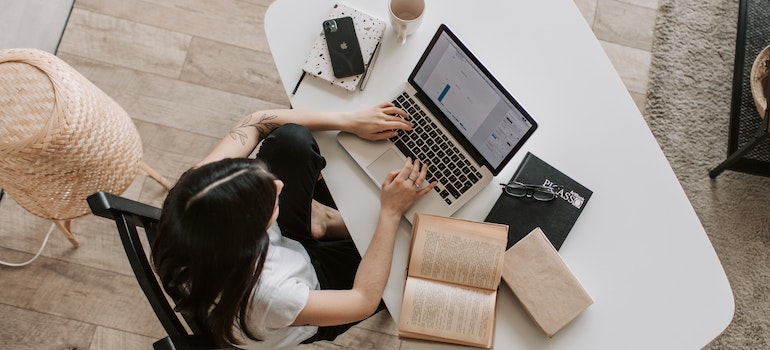 A woman researching important things about Ajax before moving there