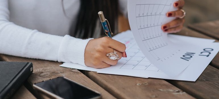 A person marking dates in a calendar