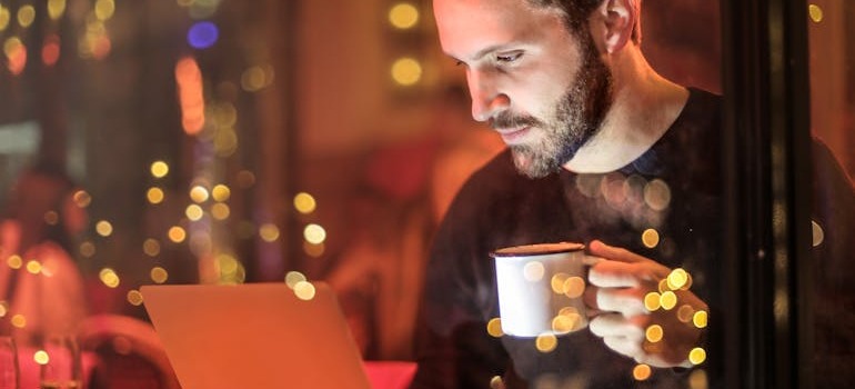 A man preparing to research & compare different moving companies on his laptop