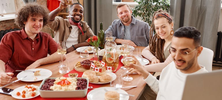 a group of young man sitting at the table and enjoying joys of moving to Oshawa