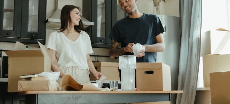 a man and a woman standing and smiling to each other