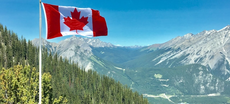 a landscape and a flag of canada