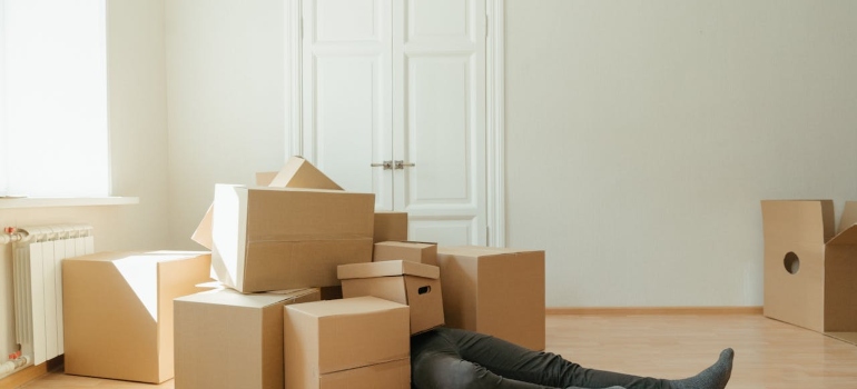 a man covered with boxes
