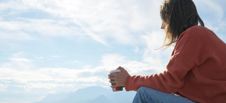 a woman thinking about the emotional benefits of moving