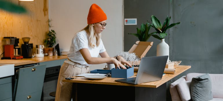 a woman reading on a laptop about the best cities for a fresh start in 2025