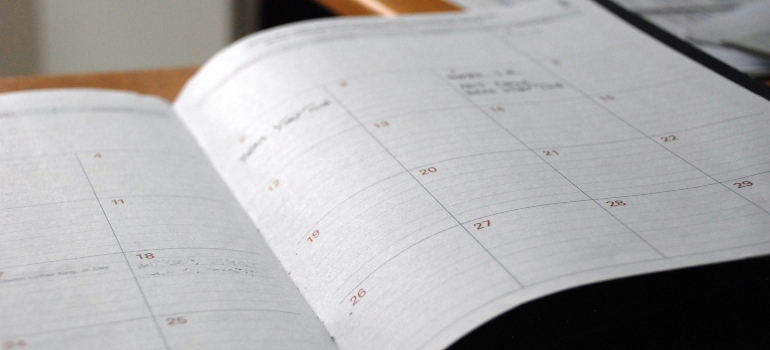 Planner on a table ready for moving with kids from Ontario to Alberta