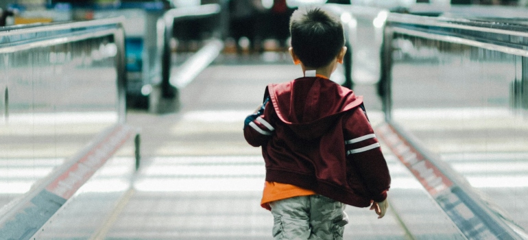 Child running at an airport