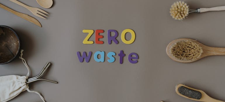 zero waste colorful letters surrounded by wooden cutlery