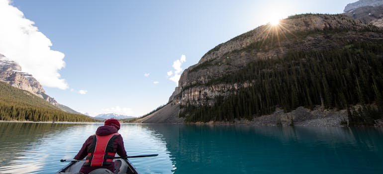 a man rafting in the kanoo in one of the places in Canada for singles