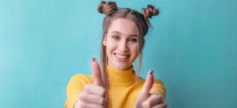 Woman who is happy because she managed to choose reliable GTA movers without falling for scams
