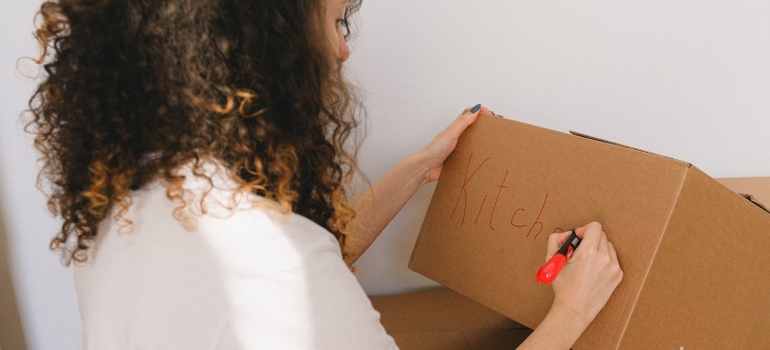 Person labeling a box