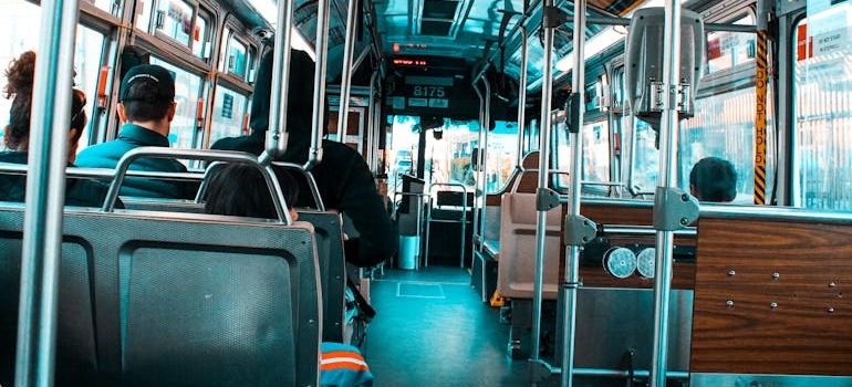 People sitting in a bus navigating North York, Oshawa, Brampton, and other areas outside the GTA