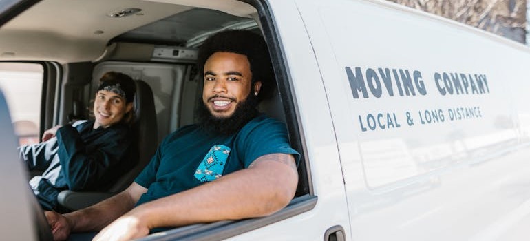 Movers inside a van