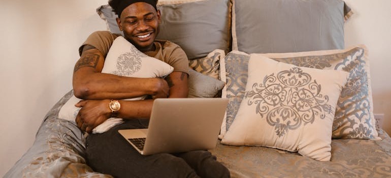 A man on a video call talking about moving for love