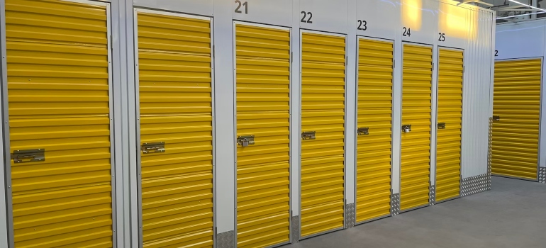 A row of yellow doorswith a number above on each